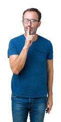 Handsome middle age hoary senior man wearin glasses over isolated background asking to be quiet...