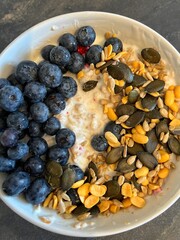 Healthy breakfast with cereals, seeds, yogurt and fruit