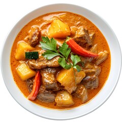 Delicious bowl of spicy thai massaman curry with tender beef and fresh vegetables