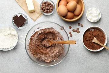Ingredients for chocolate dough on light table, flat lay