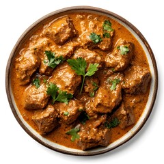 Delicious indian beef curry garnished with fresh cilantro in a ceramic bowl