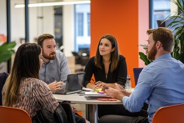 Collaborative Office Dynamics Young professionals engage in animated discussion, strategizing for business growth in a vibrant office setting.