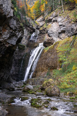 Waterfall of the strait (Estrecho waterfall) in autumn in the Ordesa Valley National Park in Aragon Pyrenees. Huesca, Spain. Ara river waterfalls.