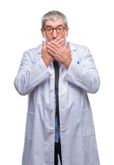 Handsome senior doctor, scientist professional man wearing white coat over isolated background shocked covering mouth with hands for mistake. Secret concept.