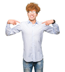 Young handsome business man with afro wearing glasses looking confident with smile on face,...