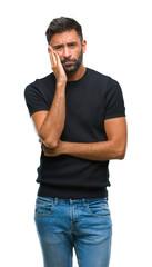 Adult hispanic man over isolated background thinking looking tired and bored with depression...