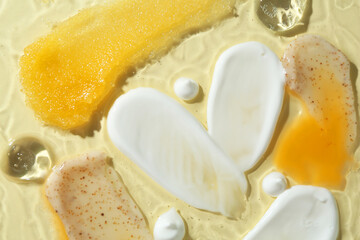 Samples of different cosmetic products on beige background, top view