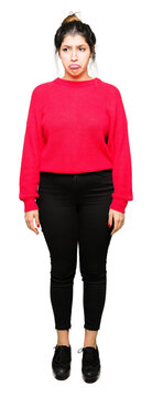Young beautiful woman wearing red sweater and bun depressed and worry for distress, crying angry and afraid. Sad expression.