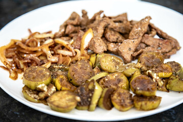 Traditional, strong and nutritious real food, liver with okra and onion