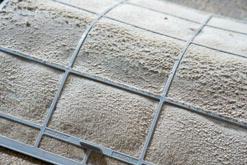 Close up of dust and dirty inside air conditioner filter.