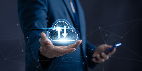 Cloud Computing and Data Transfer Technology. Businessman holding a cloud icon with upload and...