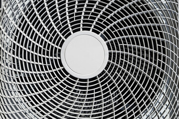 Air conditioner close-up with round plastic grille, ventilation system. Circular fan cover detail,...