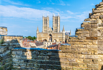 A view past the castle battlements wall towards the Cathedral in Lincoln, Lincolnshire in summertime
