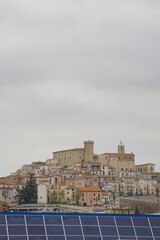 Obraz premium The village of Casoli and in the foreground a structure of photovoltaic panels
