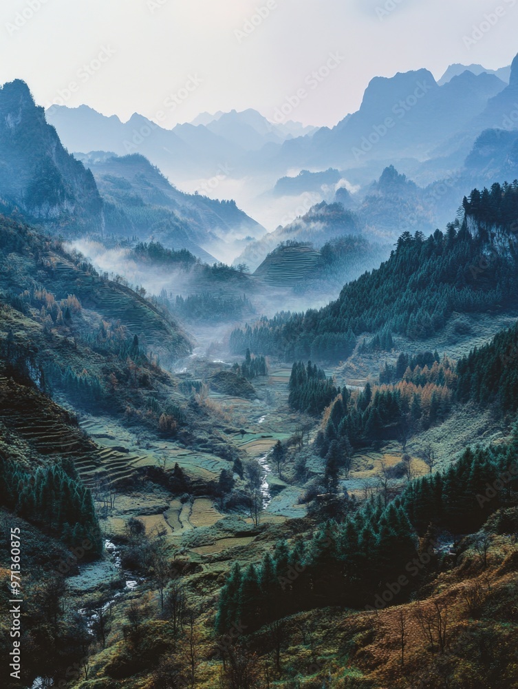 Poster a mountain range with a river running through it. the sky is cloudy and the mountains are covered in