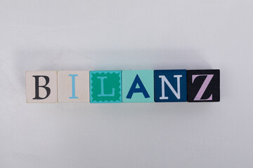 Colorful Wooden Blocks Spelling the Word 'BILANZ'