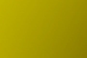 Gold textured wall background. Yellow glitter gold foil on wall sheet with glossy light reflection, luxury bright gold paper wallpaper