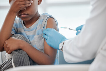 Healthcare, scared child or doctor with needle for vaccine, injection or medicine in clinic. Kid,...