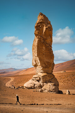 El Indio, a towering rock formation resembling a native figure, standing proud in the arid landscape of Pacana Monks (Monjes de la Pacana), on Chile?s 4000m high altiplano near San Pedro de Atacama.
