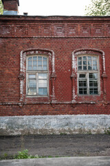 Rustic red brick facade with vintage windows