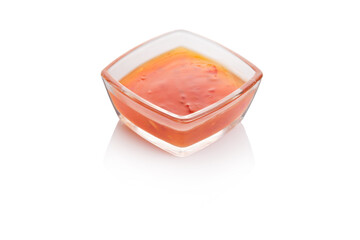 Delicious homemade salsa in a square glass bowl on a clean, white background capturing vibrant colors and freshness