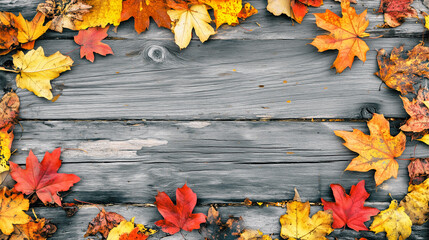 Obraz premium Frame of colorful autumn leaves on rustic wooden table
