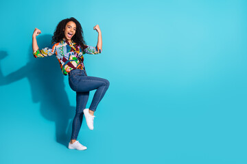 Photo of overjoyed lovely woman wear trendy clothes empty space isolated on blue color background