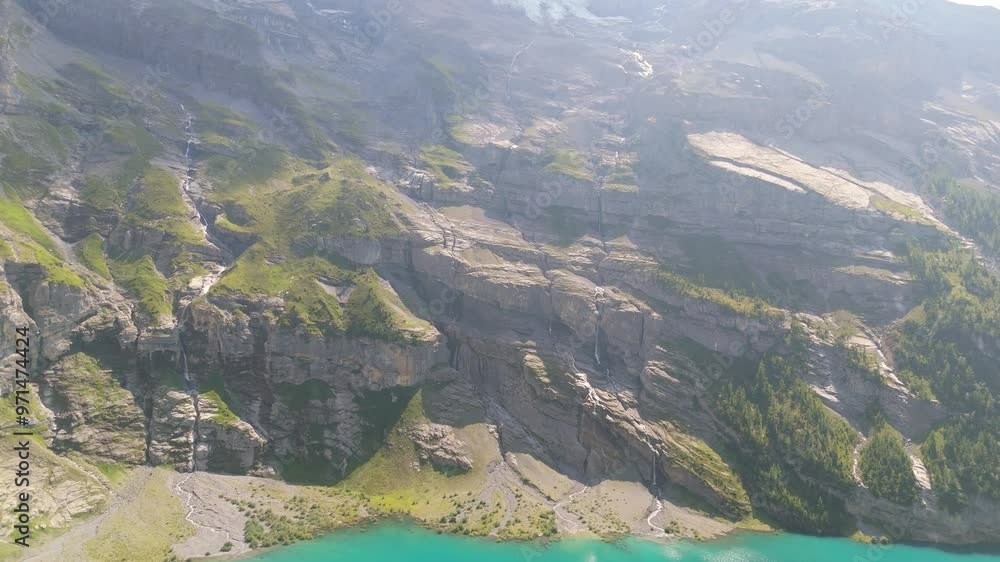 Sticker Drone scenery of Alps landscape with Lake Oeschinensee on a sunny day in Kanderstag, Switzerland