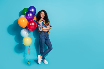 Fototapeta premium Photo of glamour lovely cute girl wear trendy clothes helium balloon standing empty space isolated on blue color background
