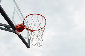 Basketball backboard hoop white net on sports court at courtyard. Outdoors. Summer game. Close up....