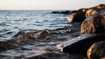  A body of water featuring rocks in the foreground