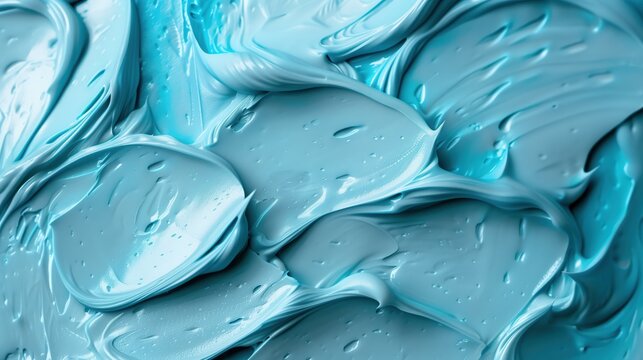 Close-up of blue icing frosting with smooth, creamy texture. backgrounds and wallpapers