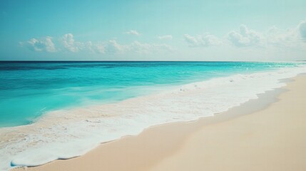 Fototapeta premium Peaceful beach with turquoise waves gently lapping on white sand, pristine and tranquil, ideal for vacation and relaxation themes.