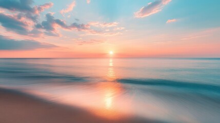 Tranquil Sunset Over Calm Ocean Waters With Soft Clouds