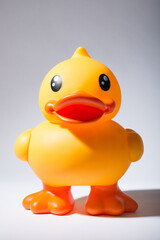 Rubber, duck and toy in studio for kids, playing and children entertainment with fun squeaky sound. Plastic bird, object and white background for bath, pool and water with childhood games or activity