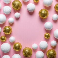 Golden and white glitter ball decoration on pink background with copy space. New Year minimal concept. Flat lay.