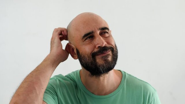 Close-up of hands scratching the head, showing a perplexed or confused reaction. The gesture reflects deep thought or confusion.