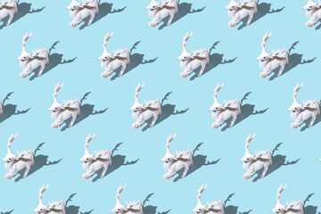 Creative Christmas pattern made of Christmas reindeer on bright blue background. Minimal Christmas or New Year concept.