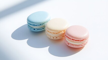 Three Colorful Macarons on a White Background