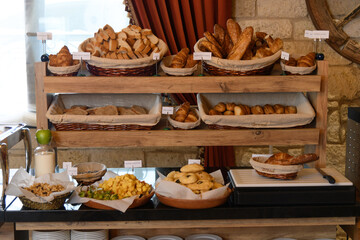 Fresh Bread and Pastry Selection in Hotel Breakfast Buffet