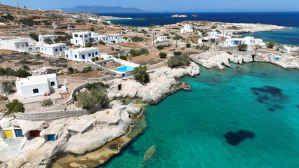 Fototapeta premium Aerial drone photo of picturesque seaside area and bay of Goupa - Karra with colourful boat houses and elephant rock a perfect place to swim, Kimolos island, Cyclades, Greece
