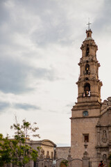 Side column of a Catholic temple in a Mexican city. Old cathedral church in the center of Aguascalientes.