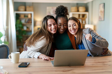 Diverse Businesswomen Celebrate Success in Office