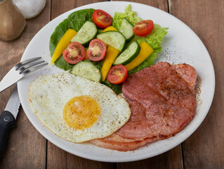Gammon steak with fried egg and mixed salad.