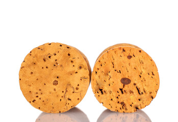 Two wine corks, macro, isolated on white background.