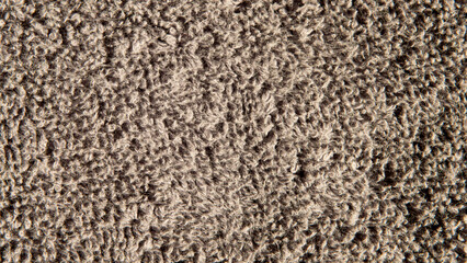 Detail of fibres of a greyish-coloured rug