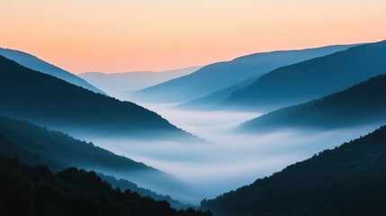 Obraz premium Serene mountain landscape at dawn with misty valleys and soft pastel skies.