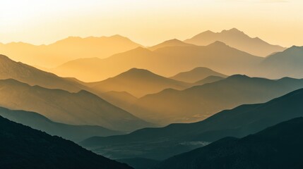 Obraz premium Serene mountain landscape at sunset, showcasing layers of peaks and warm hues.