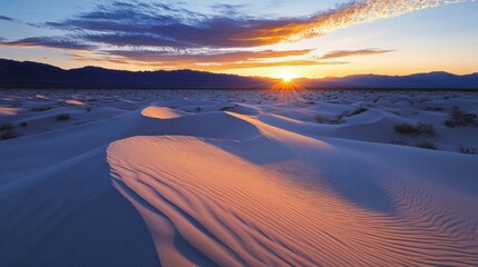 A serene sunset over desert dunes, showcasing the beauty of nature's landscape.