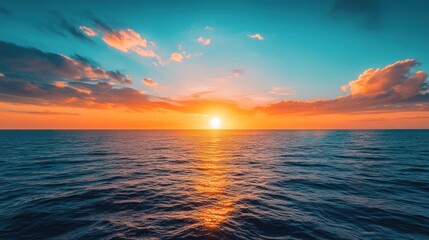 A serene sunset over the ocean, reflecting vibrant colors on calm waters.